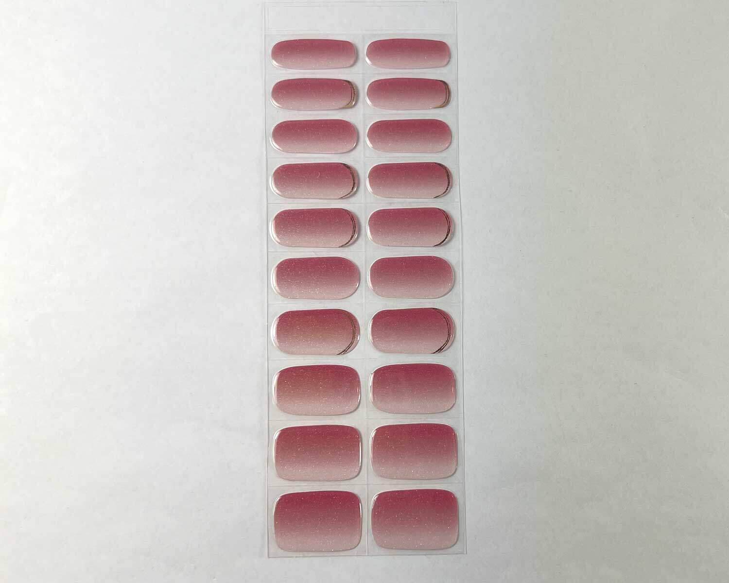 Golden sunset pink semi-cured gel nails strip showing 20 pieces with 10 different sizes on white background