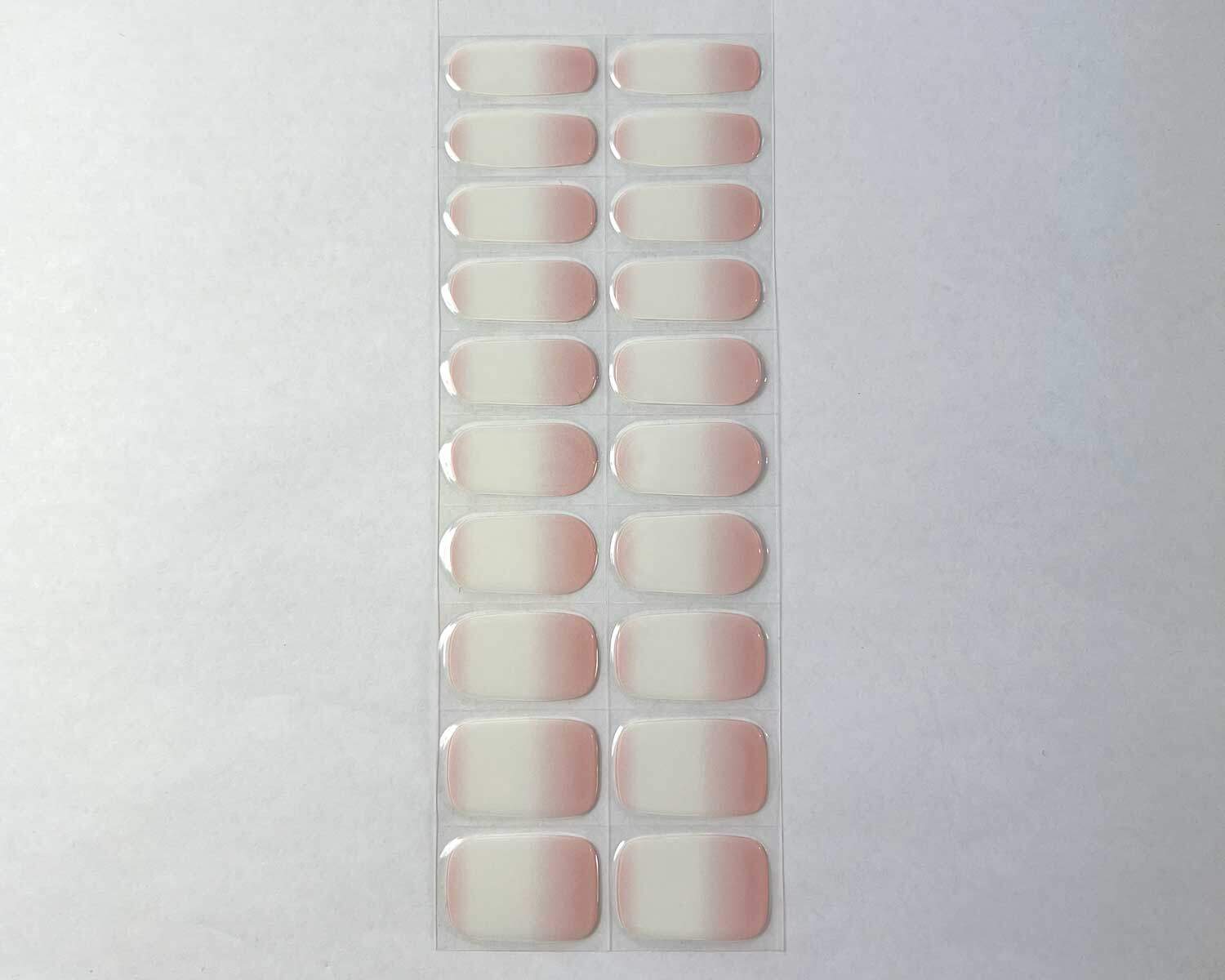 Ombre pink semi-cured gel nails strip showing 20 pieces with 10 different sizes on white background