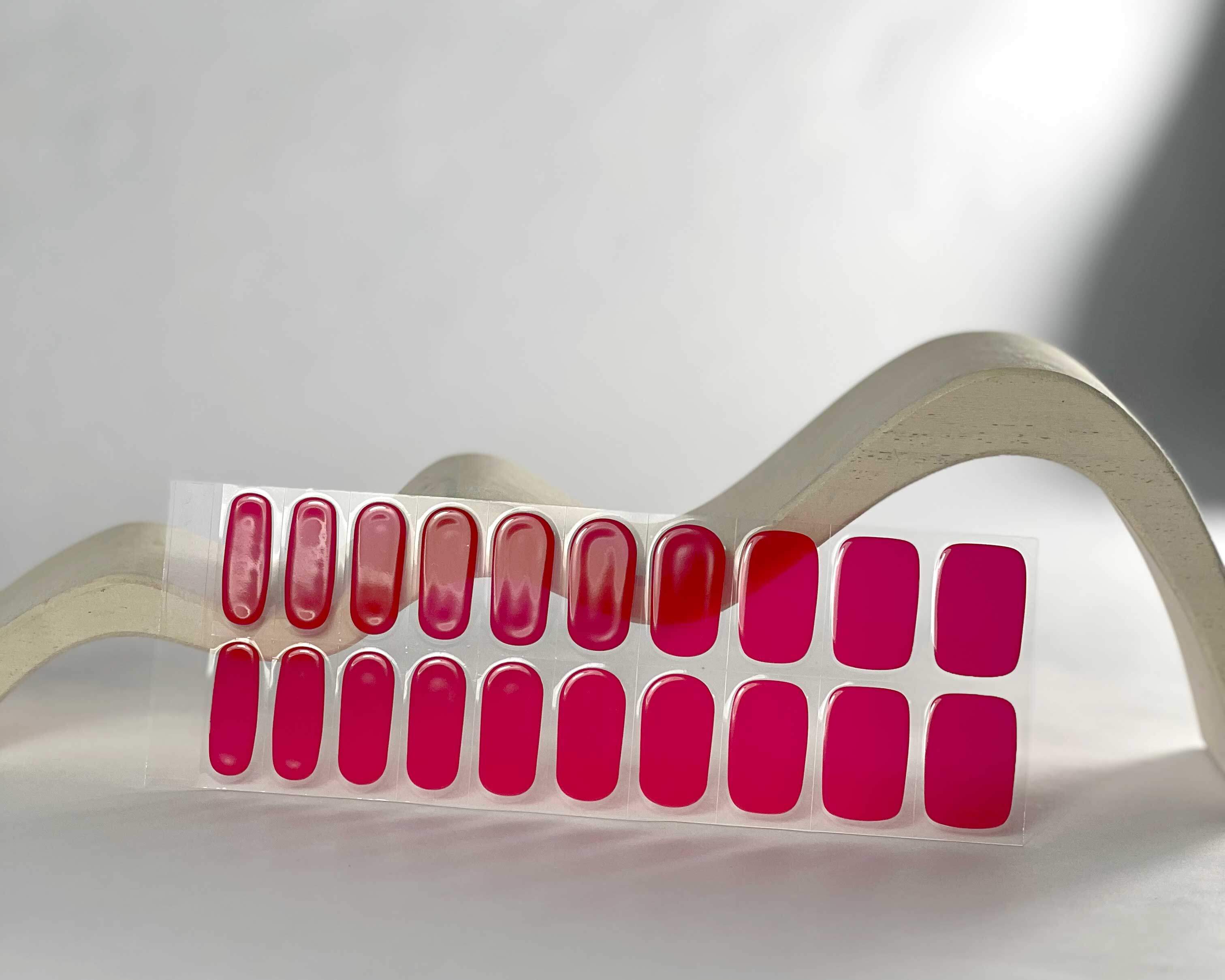 Cherry Red semi-cured gel nails in mockup to show product against white wave wooden block