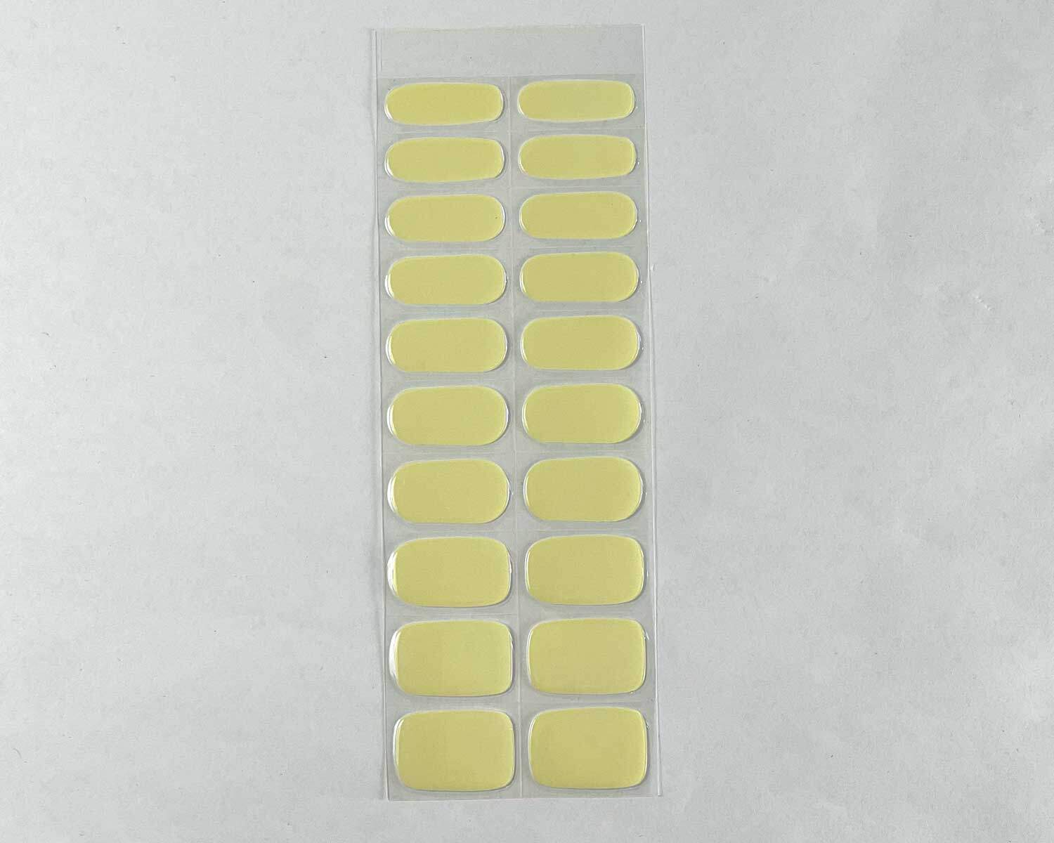 Pearlescent Lemon yellow blue semi-cured gel nails strip showing 20 pieces with 10 different sizes on white background