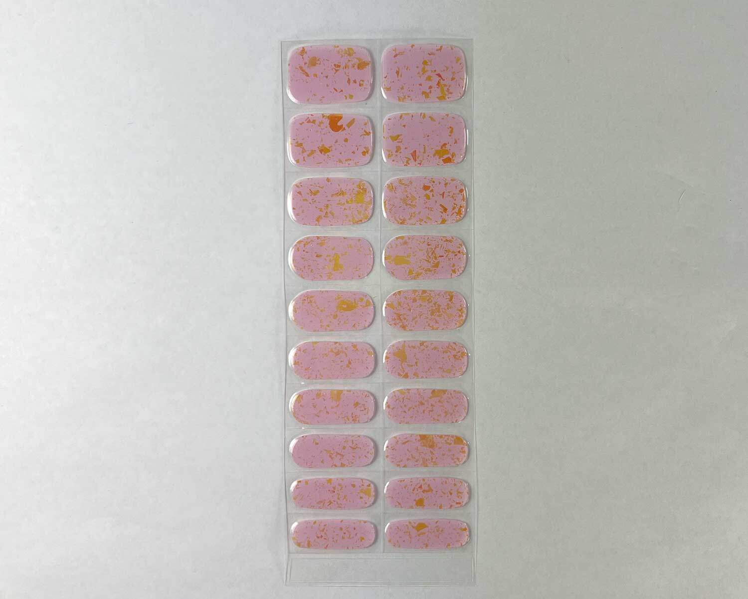 pink-speckle-semi-cured-gel-nail-strip Pink Speckle Orange semi-cured gel nails strip showing 20 pieces with 10 different sizes on white background