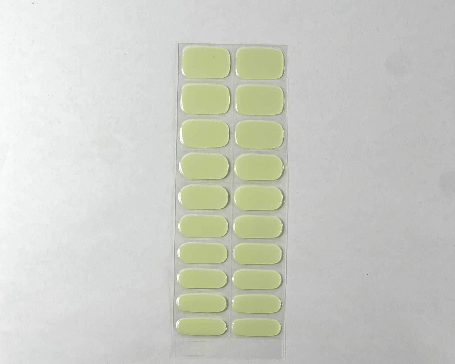 Pistachio green semi-cured gel nails strip showing 20 pieces with 10 different sizes on white background
