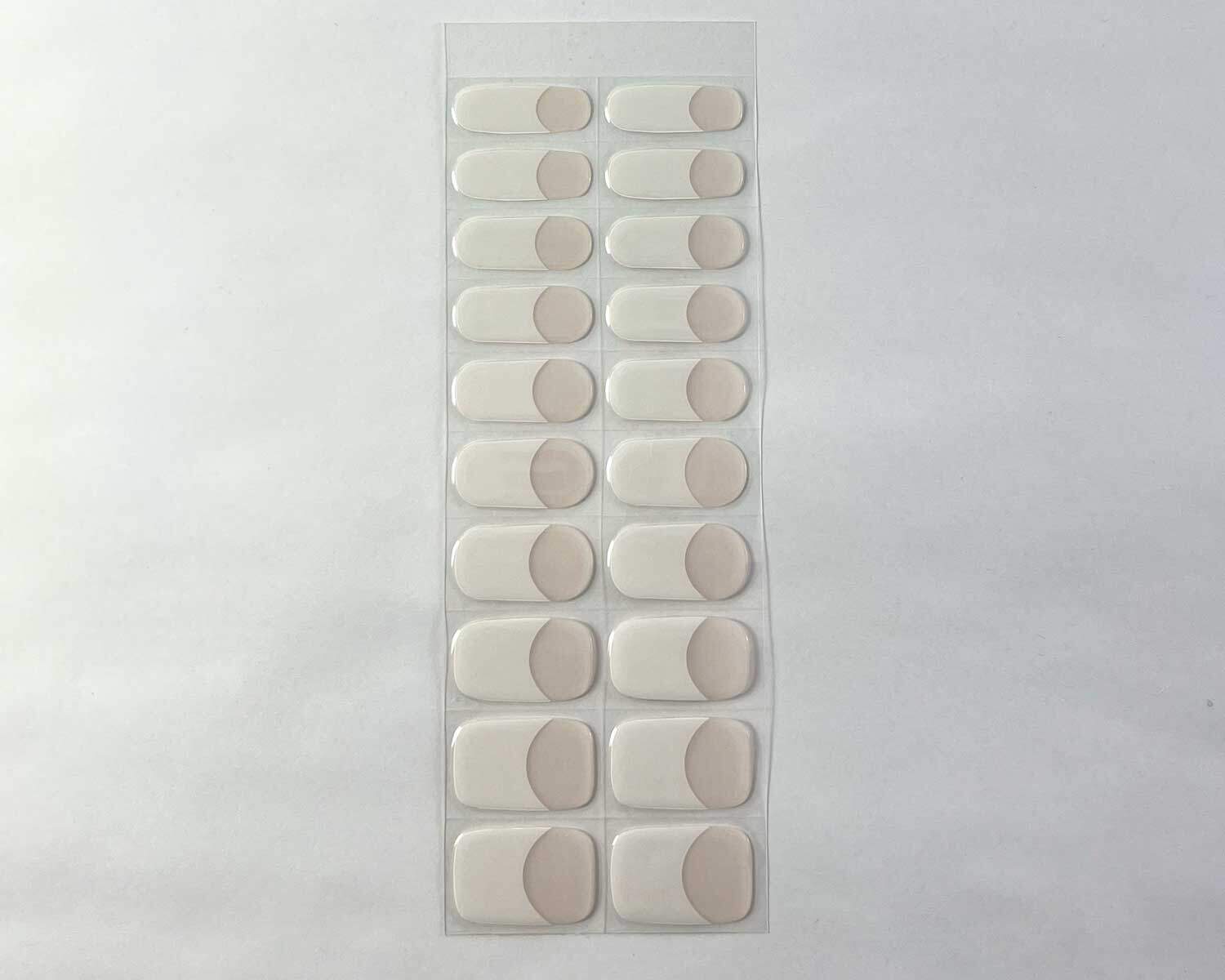 classic french semi cured gel nails strip showing 20 pieces with 10 different sizes on white background