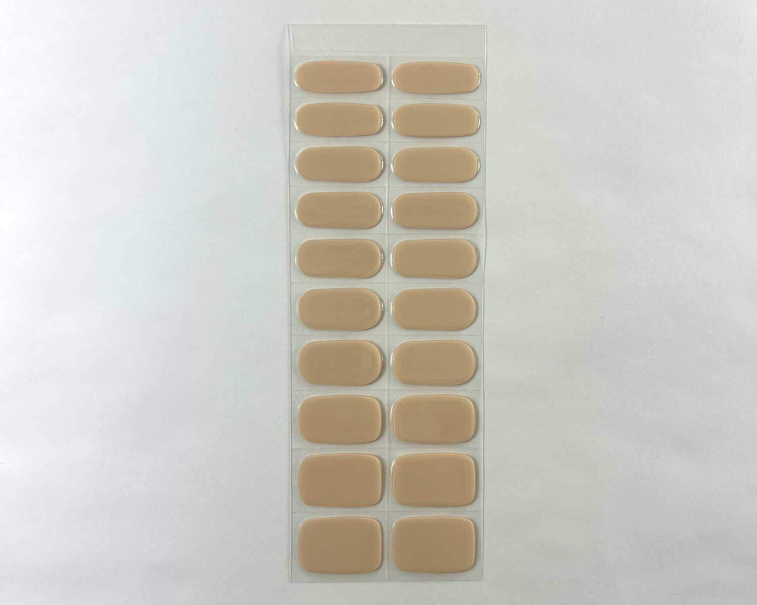 oat latte brown semi cured gel nails strip showing 20 pieces with 10 different sizes on white background
