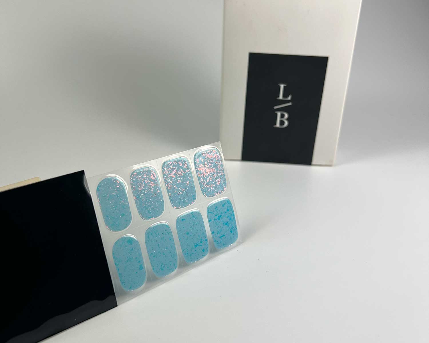 frozen-speckle-semi-cured-gel-nail-black-strip