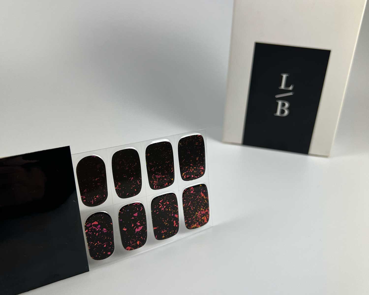 volcanic-speckle-semi-cured-gel-nail-black-strip