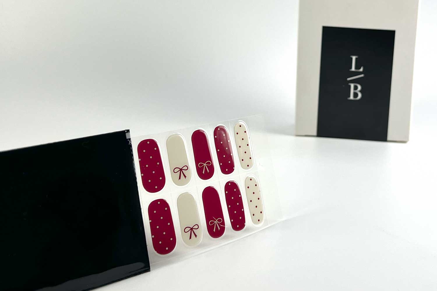 polka-dot-present-semi-cured-gel-nails-black-strip